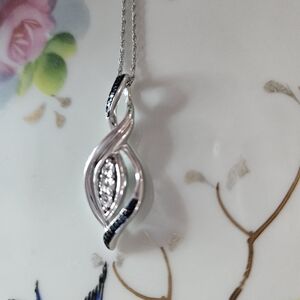 Stunning silver  pendant with diamonds.